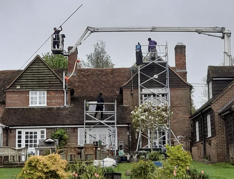 The Roof Moss Cleaners using cherry picker and scaffolding to clean roof safely and professionally in Radlett, Hertfordshire