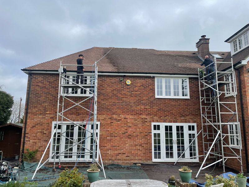 Roof cleaning carried out safely from scaffold towers by The Roof Moss Cleaners in Radlett